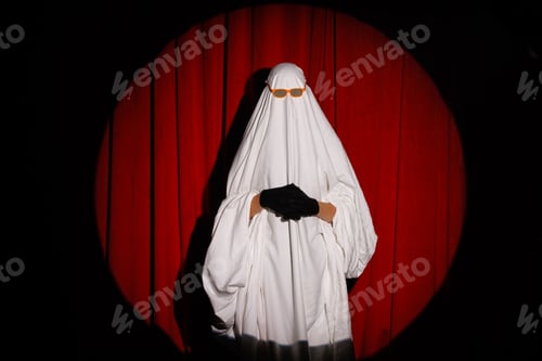 Preview: Happy Halloween. Cute funny Ghost on a bright orange background. Sheet Ghost costume