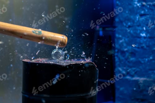 Preview: close up of a baseball bat smashing a glass in a destroy room for stress relief glass flies