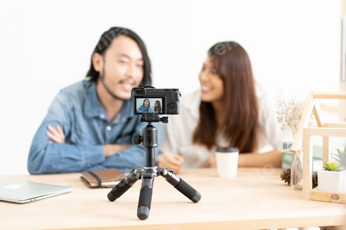 Preview: Young asian couple blogger with recording video.