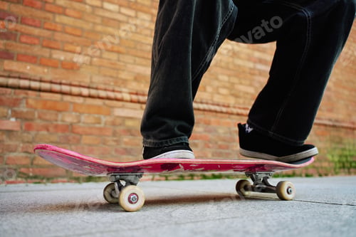 Preview: Skateboarder doing trick at urban street
