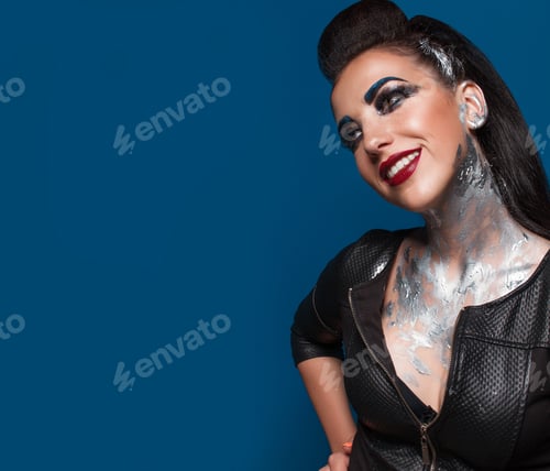 Preview: Girl With Creative Make-Up On A Blue Background