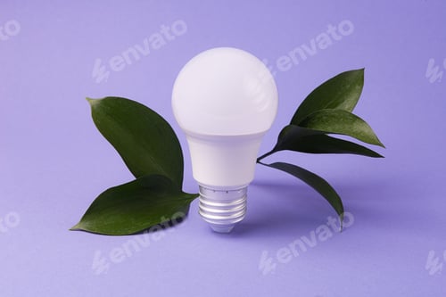 Preview: Led bulb with frsh green leafs,green energy concept.