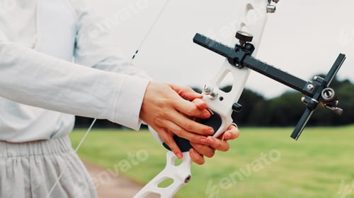 Preview: Person, archery and hands at field for sport at shooting practice and training as athlete in Japan.