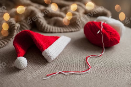 Preview: Christmas preparations - santa hat crocheted of red and white yarn as a gift for a baby with lights