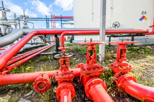 Preview: Red industrial piping valves at biofuel plant