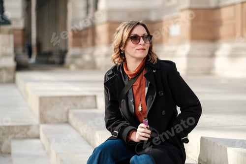 Preview: Stylish Woman Sitting on Urban Steps