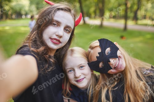 Preview: Teenage Girls Taking Selfie on Halloween