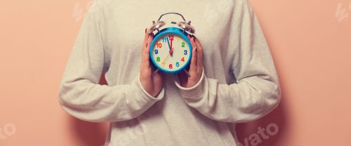 Preview: Woman holding clock