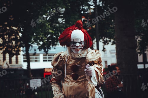 It. Costume. Clown. Close-up. Horror movie. Red color. Front view. Film. Focus on foreground.