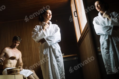 Preview: Beautiful woman relaxing in sauna and staying healthy