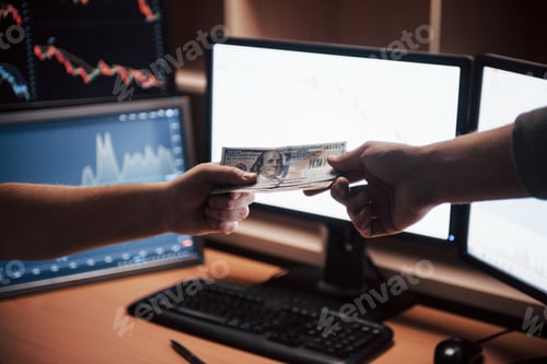 Preview: Here's your payment. Day of salary in the modern office with screens and graphs on them
