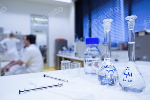 Preview: chemistry lab (shallow DOF; focus on the glassware in the foregr