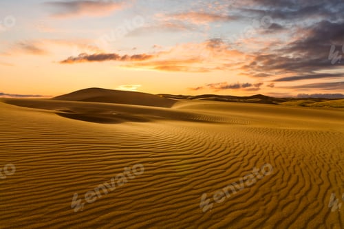 Preview: Sunset over the sand dunes in the desert. Sahara desert