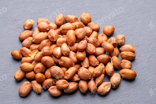 Preview: Roasted Peanuts in Wooden Bowl on Gray Background