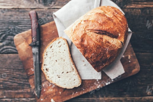 Preview: Delicious fresh bread on wooden background
