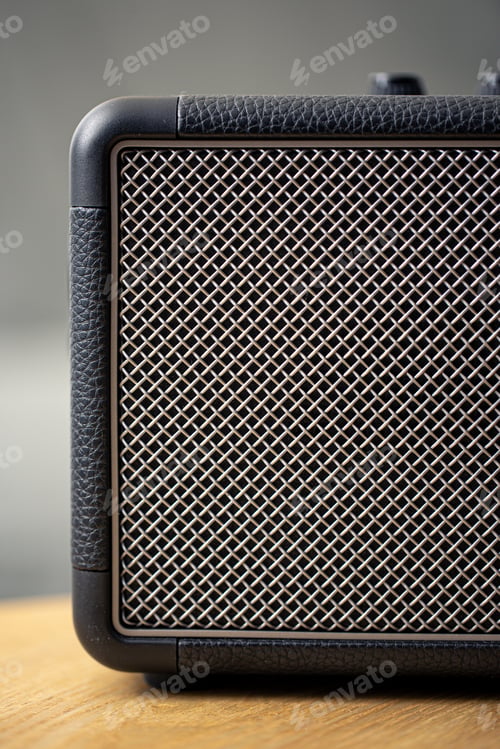 Preview: Square music speaker, metallic mesh texture close-up.
