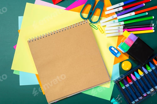 Preview: School and office supplies on blackboard