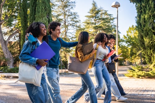 Preview: Diverse students walking on campus after classes