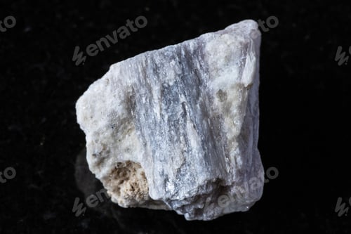 Preview: sample of raw rubellite crystal in rock on black