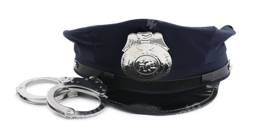 Preview: Police cap and handcuffs on white background