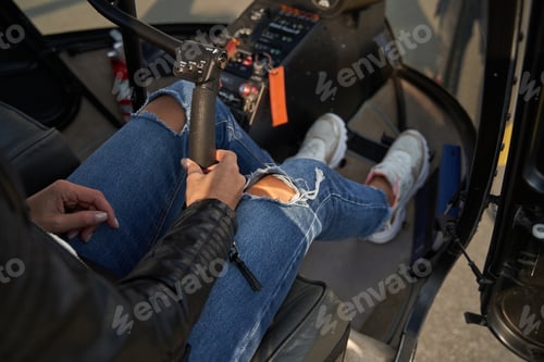 Preview: Fragment photo of female helicopter pilot being in charge