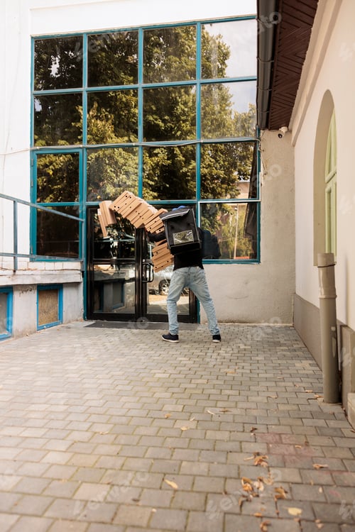 Preview: Deliveryman dropping pizza boxes huge pile back view