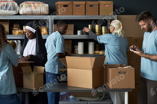 Preview: Volunteering Group Packing Food for Community