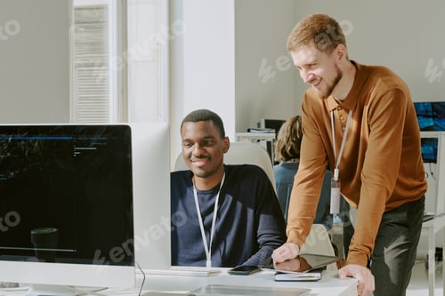 Preview: Cheerful Young Men Coworking in IT Office
