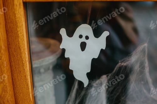 Preview: Paper cut ghost and cobweb on door or window at store