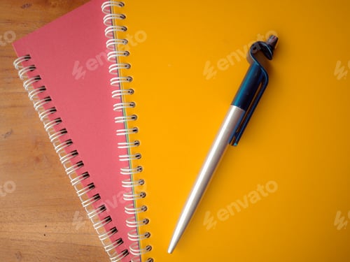 Preview: Spiral Notebooks and Pen on Wooden Background