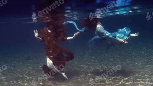 Preview: Two Girls In Dresses Play Underwater