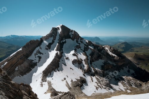 Preview: Photo of snow-capped mountain peaks