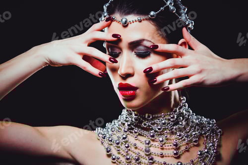 Preview: fashion woman with perfect skin wearing dramatic makeup