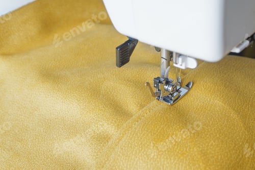 Preview: Modern Sewing Machine With Yellow Velours Fabric Close Up