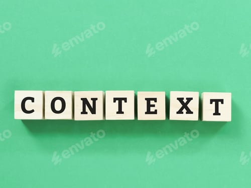 Preview: Phrase context on wooden cubes isolated on green background.