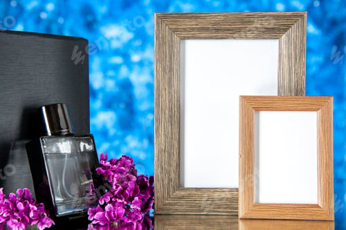 Preview: front view black expensive fragnance with picture frames on a blue background present perfume