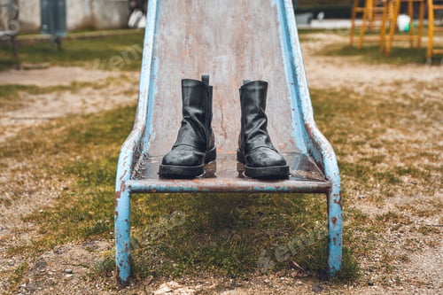 Preview: boots on slide in the park