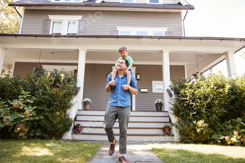 Preview: Father Giving Son Ride On Shoulders Outside House