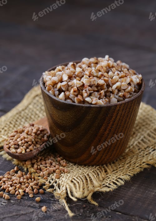 Bowl of Buckwheat Groats on Rustic Wooden Surface