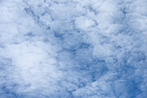 Preview: White clouds cluster on blue sky background