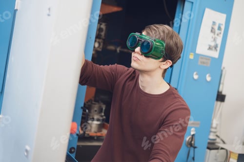 Preview: portrait of an industrial worker in protective welding glasses b