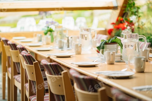 Preview: Cozy Interior Of Summer Cafe. Jug Of Water On Table And Cutlery Laid Out