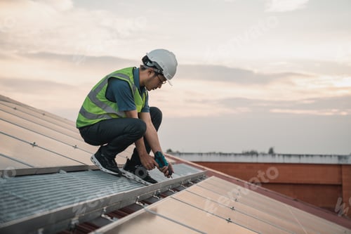 Preview: Service engineer checking solar cell on the roof for maintenance if there is a damaged part.