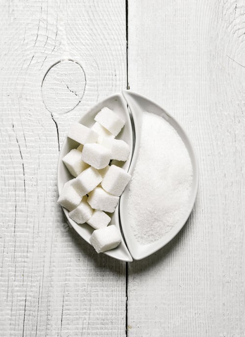 Preview: Sugar and refined sugar. On white wooden background.