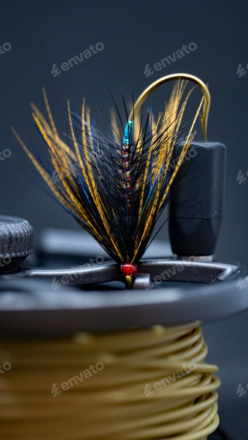 Preview: Vertical closeup shot of a hook for fly fishing