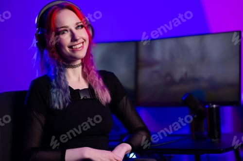 Preview: Young female streamer gaming in a modern setup with vibrant lighting