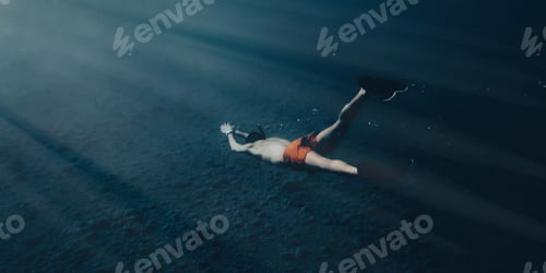 Preview: Boy swims in apnea underwater in the ocean
