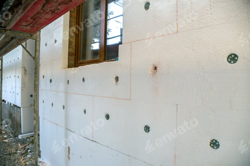 Preview: Insulation work of house walls with styrofoam sheets.