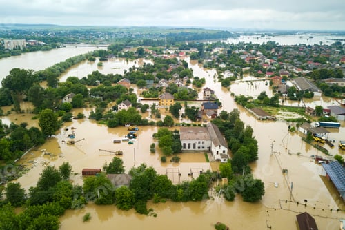 Preview: Aerial view of flooded houses with dirty water of Dnister river in Halych town, western Ukraine
