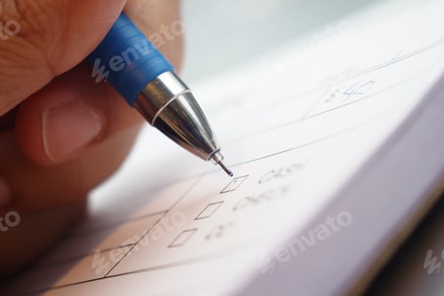 Preview: A CloseUp View of Hand Writing on Paper Using a Blue Pen Instrument